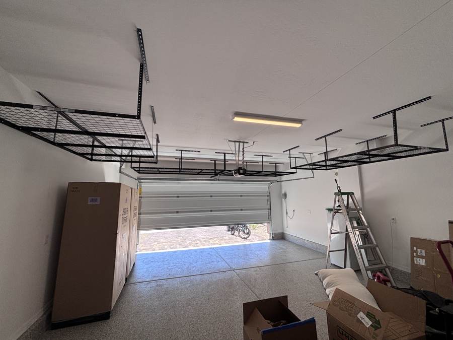Overhead storage racks installed in a St. George three-car garage